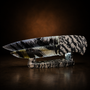 Handcrafted matching pair of Midnight Lace Obsidian knives by Joel Robinson featuring Zebra Marble handles and matching Zebra Marble display stand.