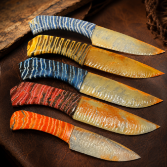 Agatized Florida Coral Knife Collection with Stabilized Woolly Mammoth Tooth Handles by Joel Robinson Stoneworks.