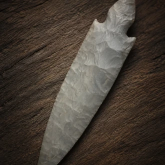 Handcrafted Harrison Turkey Tail point flintknapped from Hornstone Chert by Joel Robinson, featuring elegant symmetry and finely executed pressure flaking.