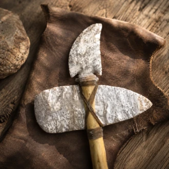 Handcrafted War Hawk featuring a flintknapped Muldraugh Chert blade mounted on a wooden handle by Joel Robinson.
