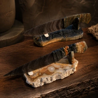 Matching handcrafted Davis Creek Banded Obsidian knives with sculpted Picasso Marble handles by Joel Robinson.